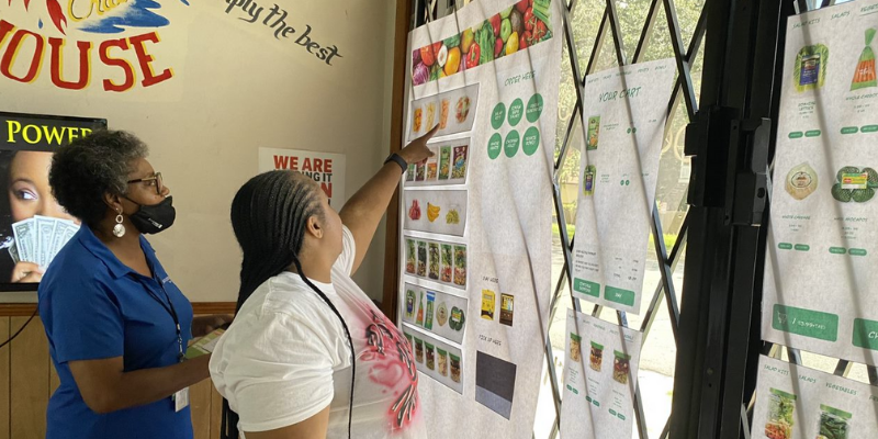  Residents interact with the healthy vending machine prototype